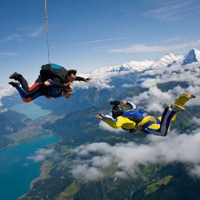 Skydivers and cameraman over Reichenbach, Bern, Switzerland